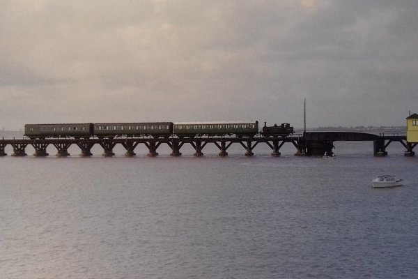 Hayling Billy traversing railway bridge, Hayling Island
